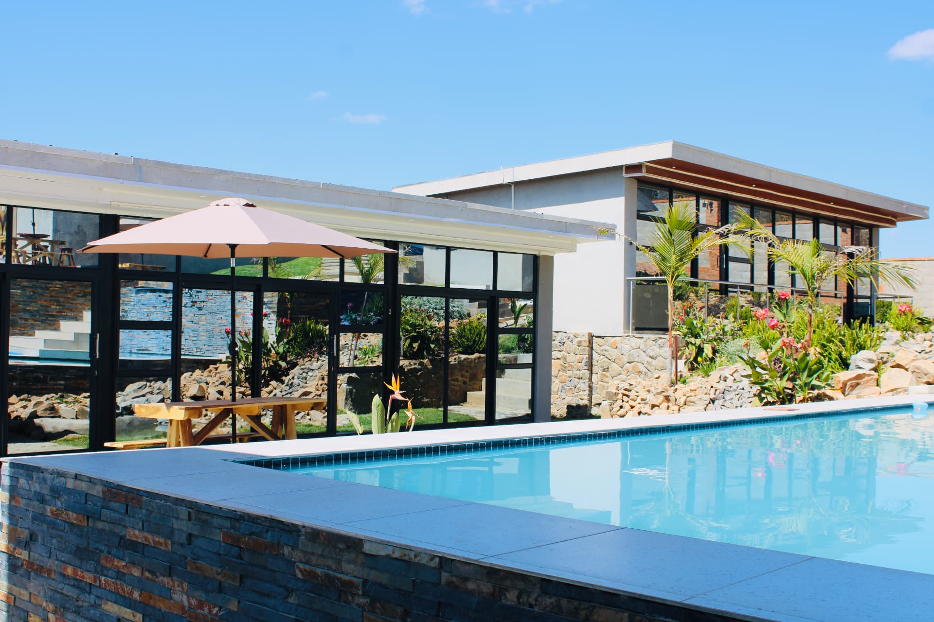 The pool and shaded terrace at Lions Gate